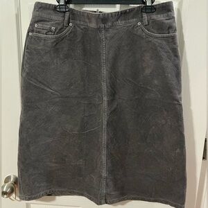 Woman’s corduroy grey skirt.